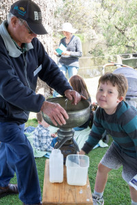 Milk separating with Society member volunteer Elwyn Harries and an eager assistant